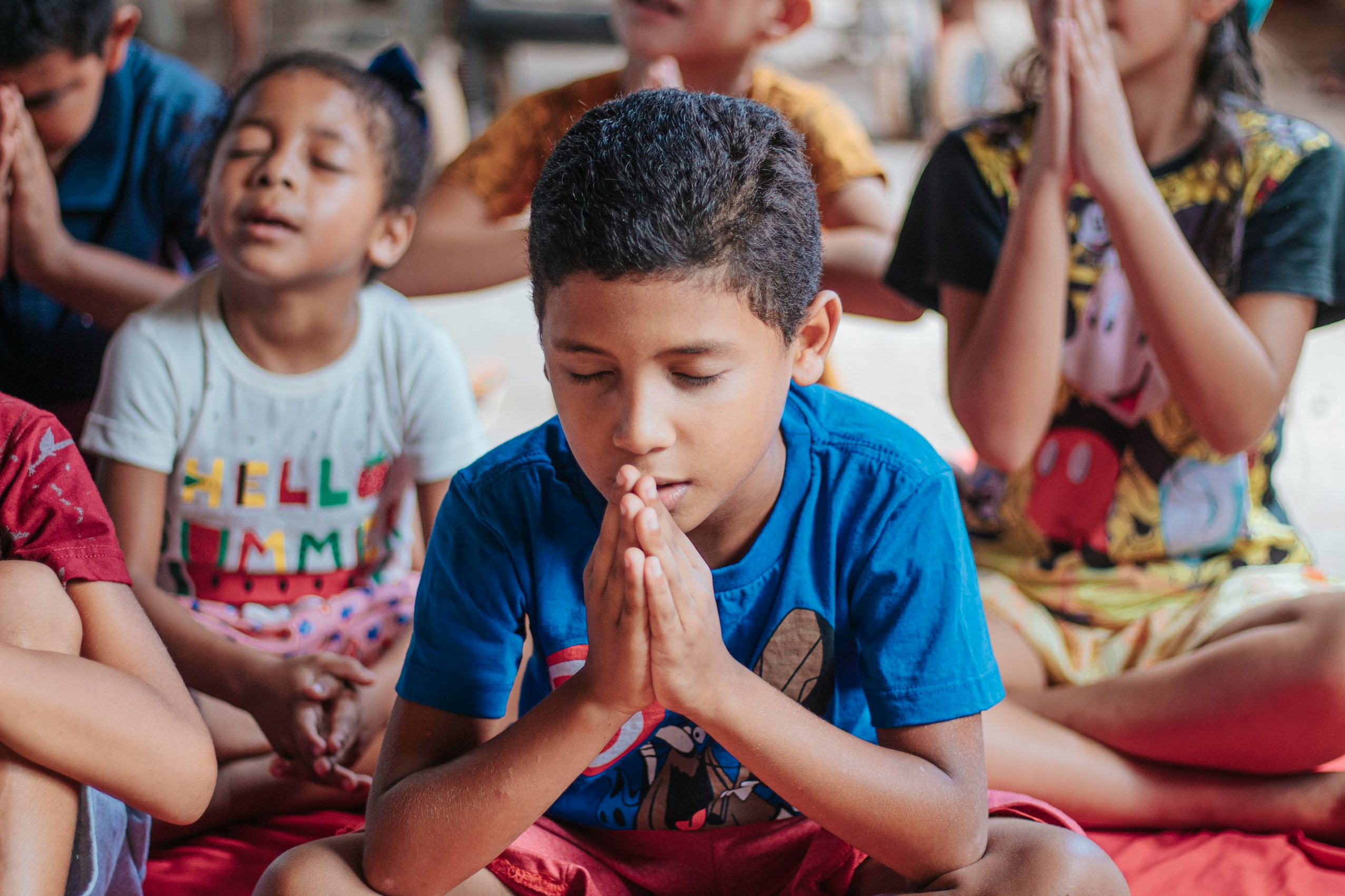 Children praying in Bible Study